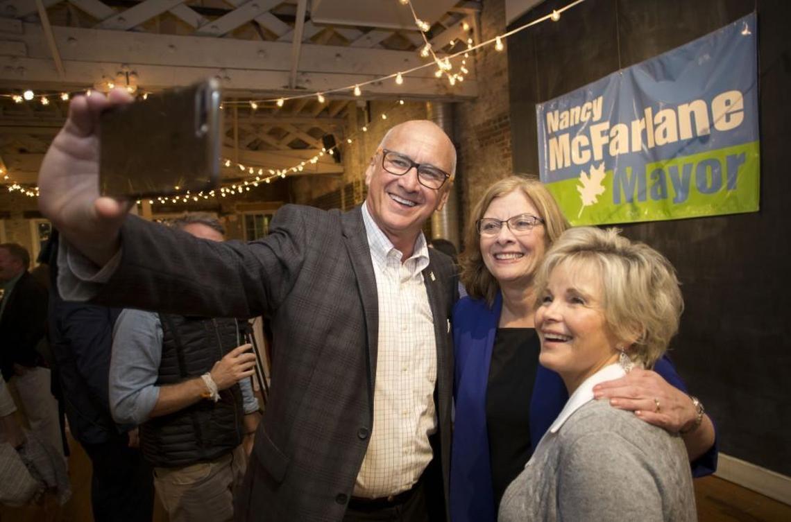 Raleigh Mayor Nancy McFarlane poses for a victory photo with Sig Hutchinson, chairman of the Wake County Commissioners, and his wife Nancy Hutchinson during an election-night gathering at the Stockroom on Tuesday, Nov. 7, 2017.