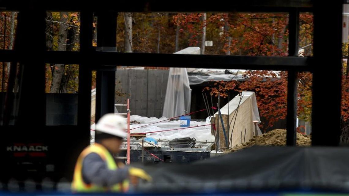 A worker leaves the scene after a pedestrian bridge that was under construction collapsed, killing one worker and injuring four others at Wake Tech's Northern Wake Campus in Raleigh, N.C. on November 13, 2014. The bridge spans 240 feet. The 140 foot center section collapsed.