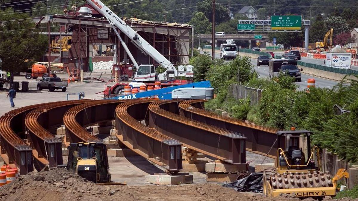 Construction and improvements to Capital Blvd. intersect with the demolition of the City of Raleigh’s garage and maintenance facility between Wade Avenue and Peace Street on Tuesday, July 11, 2017 in Raleigh. The area is also being used to stage supplies for the construction of the new highway and bridges.