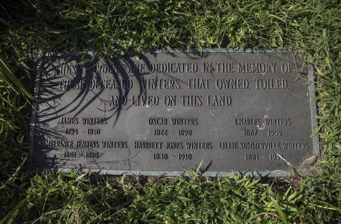 A family memorial plaque sits near the in an overgrown patch of grass near Winters Square. The sale of Wintershaven and nearby Winters Square were the result of the Winters family’s deteriorating financial situation and a legal dispute over the Winters’ trusts.