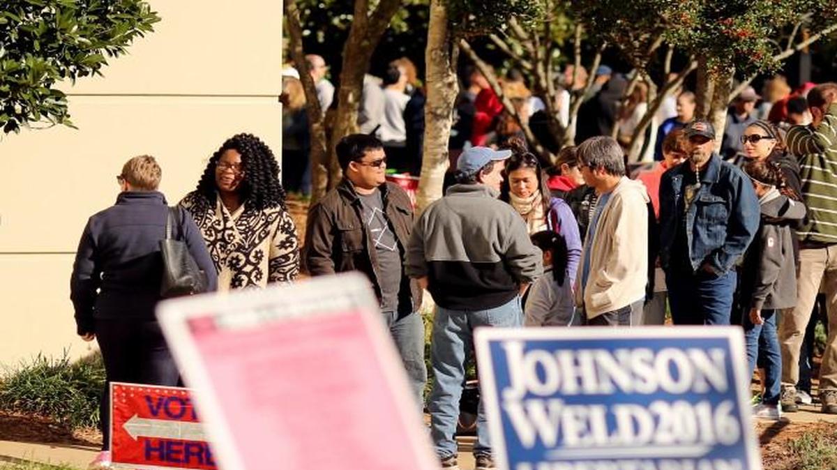 Folks wait in line for the final day of early voting at the Herbert C. Young Community Center in Cary last November.