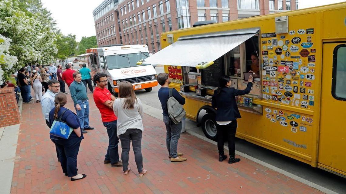 
Diners line up for the Chirba Chirba Dumpling food truck on the N.C. State Centennial Campus in April. The Only Burger truck is in the background.
