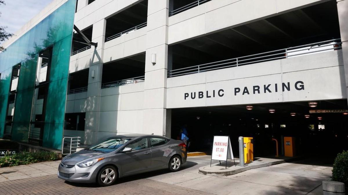 A car exits a Raleigh city parking deck at the corner of Salisbury and South Streets in downtown Raleigh, Thursday.