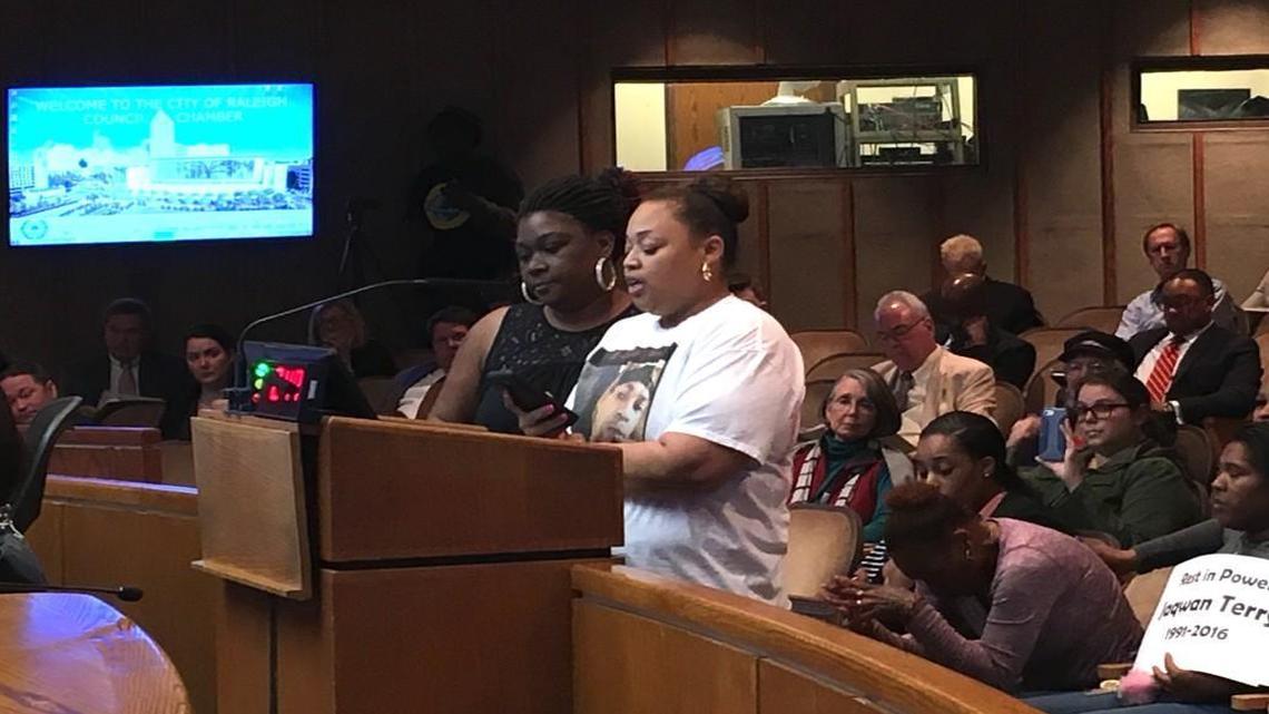 Rolanda Byrd stands with Aisha Flood during the Raleigh City Council meeting Tuesday, where Flood asked city leaders to apologize for the death of Maurice Harden and Jaqwan Terry, who were killed by police officers in separate instances.