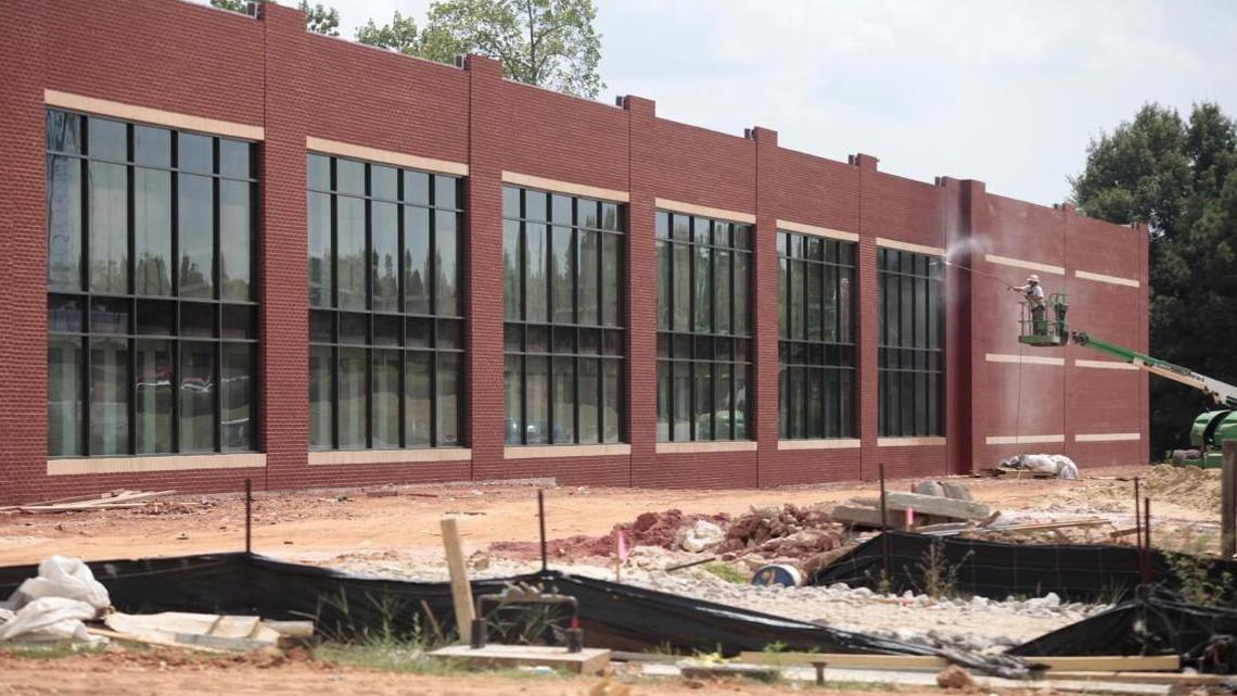 A contractor power washes the new two-story windows and the brickwork on a new self-storage climate-controlled facility under construction in the 4200 block of Atlantic Avenue in north Raleigh, NC Wednesday, August 31, 2016. Facilities like this proposed in two downtown Raleigh locations are facing opposition from neighbors.