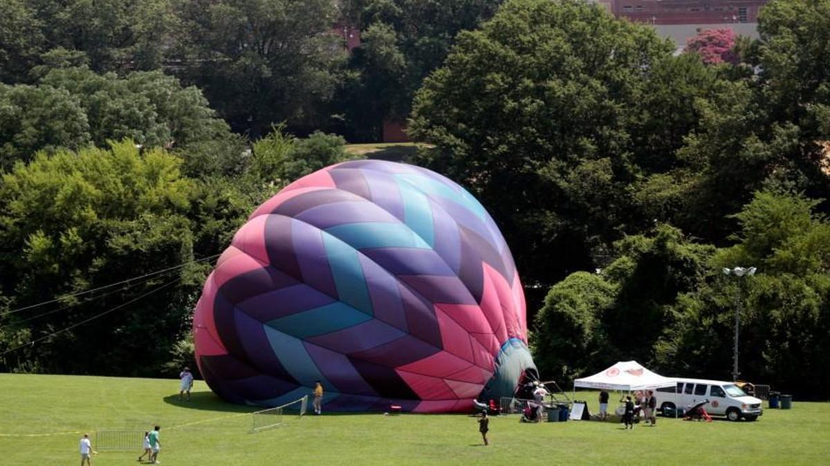 Big Red’s balloon ride let people play inside a giant partially inflated balloon (without their shoes) during the first annual Destination Dix community festival at Dorothea Dix Park in Raleigh last July.