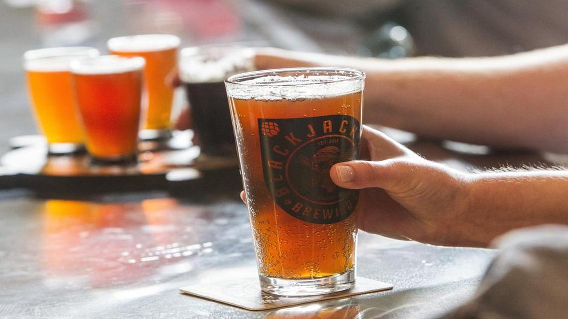 
Patrons drink brews Saturday, May 2, 2015 at Blackjack Brewing Company in Raleigh. Blackjack is one of the newest breweries in Raleigh's budding brewery district.
