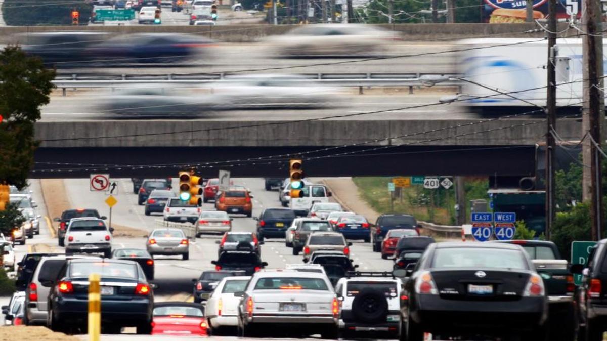 Rush hour traffic on Interstate 40 flows over South Saunders Street in Raleigh. Wake is one of 19 North Carolina counties where vehicle emissions inspections are still required.