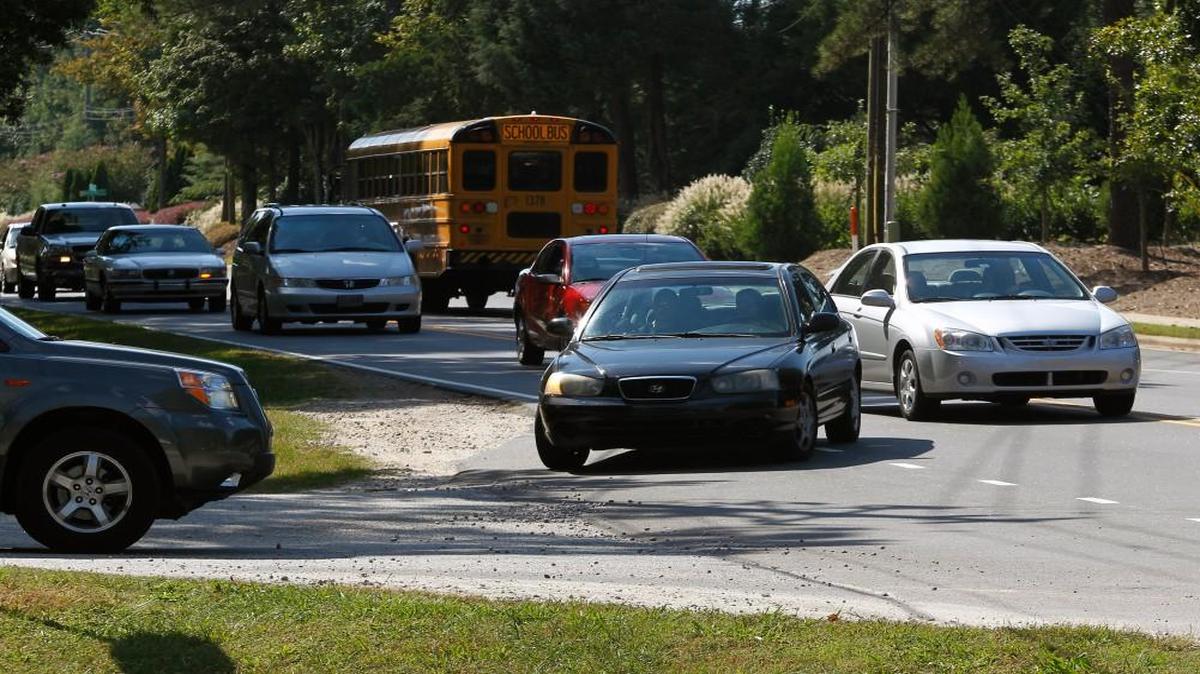 Vehicles travel on Old Wake Forest Road between Capital Boulevard and Litchford Road in North Raleigh on Oct. 2, 2013. This stretch of road was slated for widening and other improvements as part of a transportation bond.
