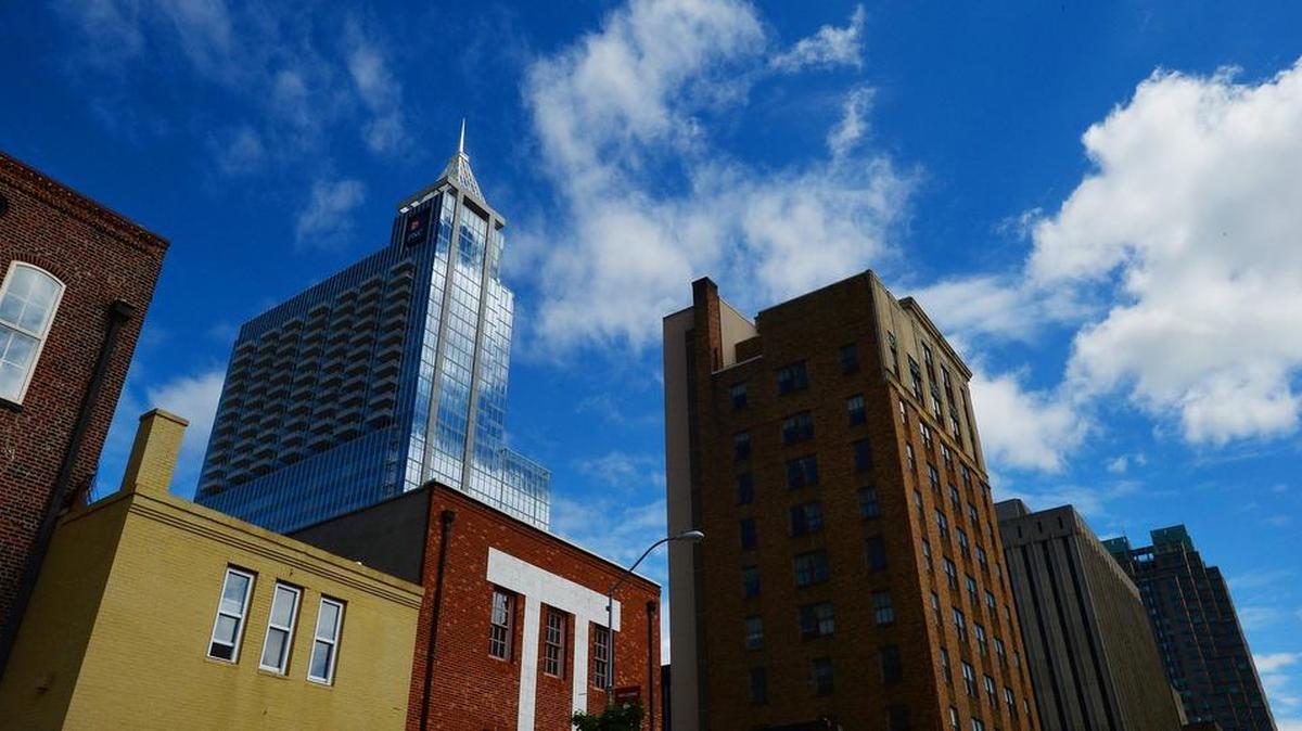Raleigh is making new rules for downtown development. The city is setting new height limits for downtown, likely making it easier to build higher without getting council approval. Here the PNC building looms over shorter building nearby on Friday, May 8, 2015.