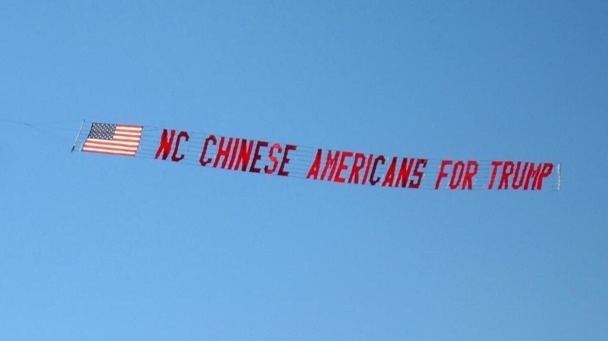 A group of Chinese-Americans who support Republican Donald Trump for president had a Trump banner flown behind a plane on Saturday in Sanford.