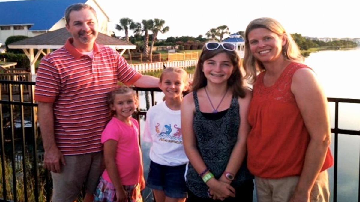 This photo of Ellie with her family was taken about four days before her death in July 2014.