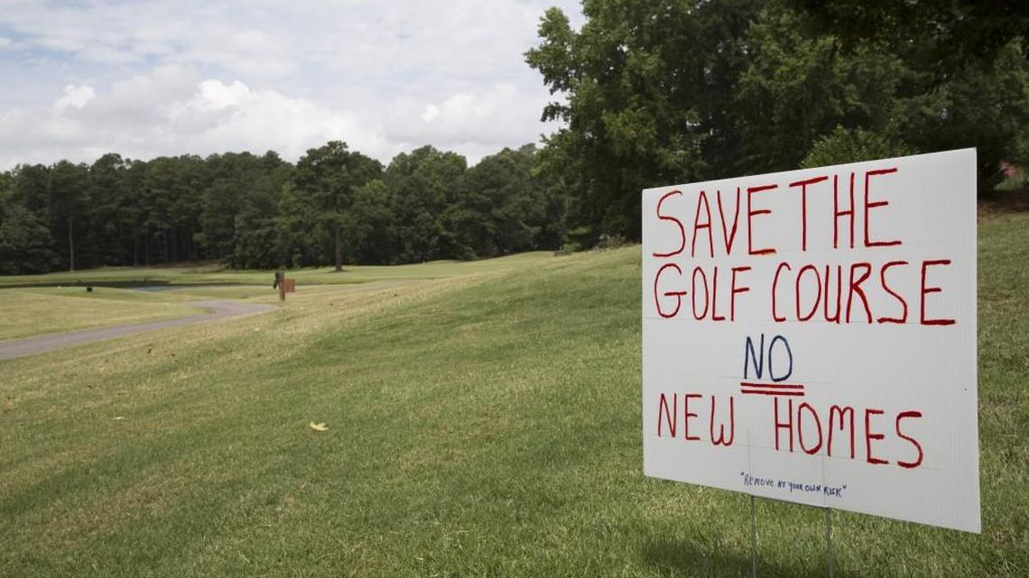 A homeowner had this sign, photographed Thursday, July 3, 2014, posted on his lawn near the No. 3 tee at Crooked Creek Golf Club in Fuquay-Varina.