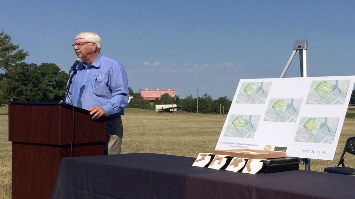 State Agriculture Commissioner Steve Troxler speaks Thursday about the planned $94 million Agricultural Sciences Center to be built on a pasture behind him at the corner of Edwards Mill and Reedy Creek roads in Raleigh.