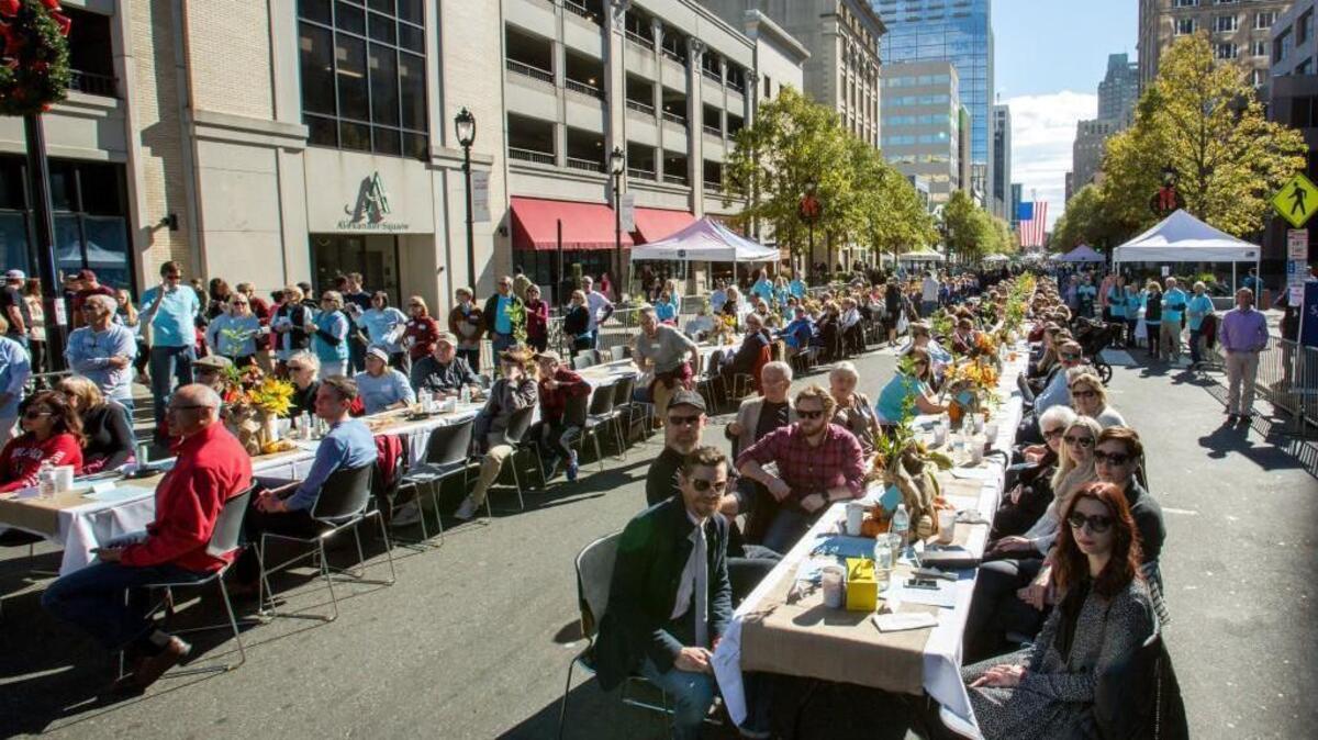 People gather for Sunday Supper on Fayetteville Street in 2016. A similar event will be Nov. 11, 2018, to raise money for those affected by Hurricane Florence.