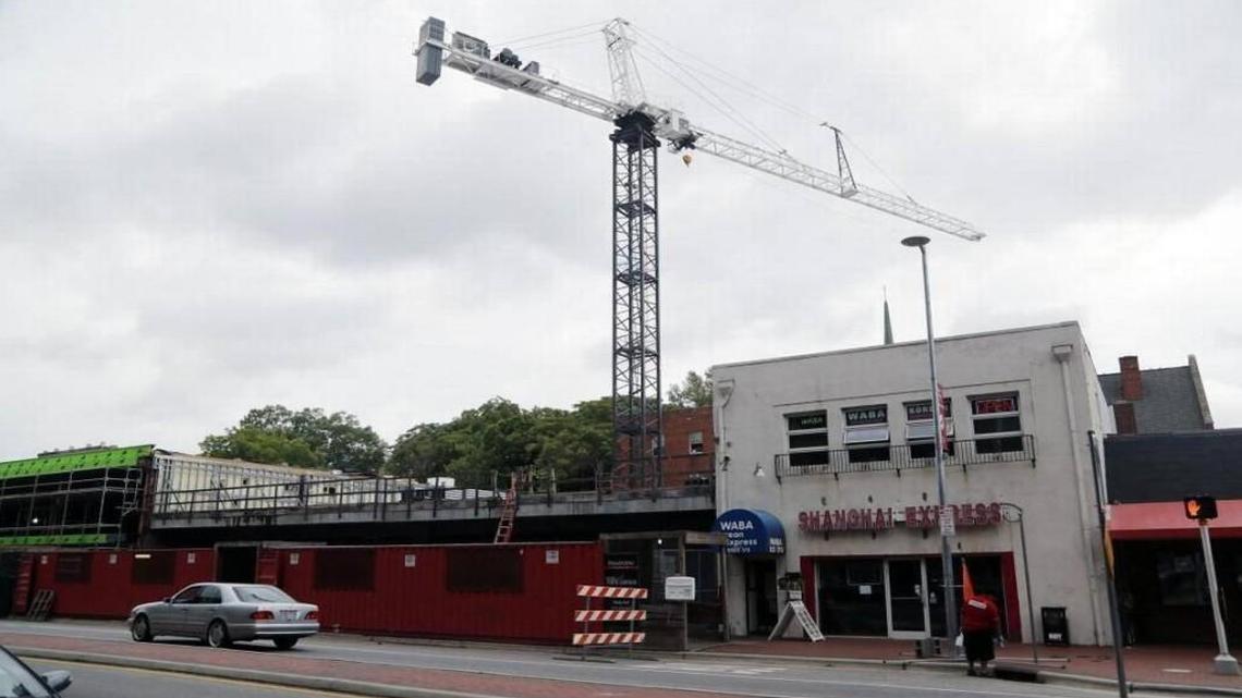 A crane towers over a construction site on Hillsborough Street in Raleigh’s District D. The corridor has been the site of new, student-oriented development in recent years.