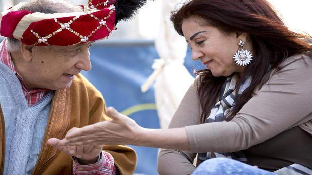 
Frank Haidar, left, tells Sanaa Haddad, right, her fortune inside of the fortune telling booth during the 17th annual Lebanese Festival hosted by the Triangle Lebanese Association Saturday, April 4, 2015 in Raleigh, N.C.
