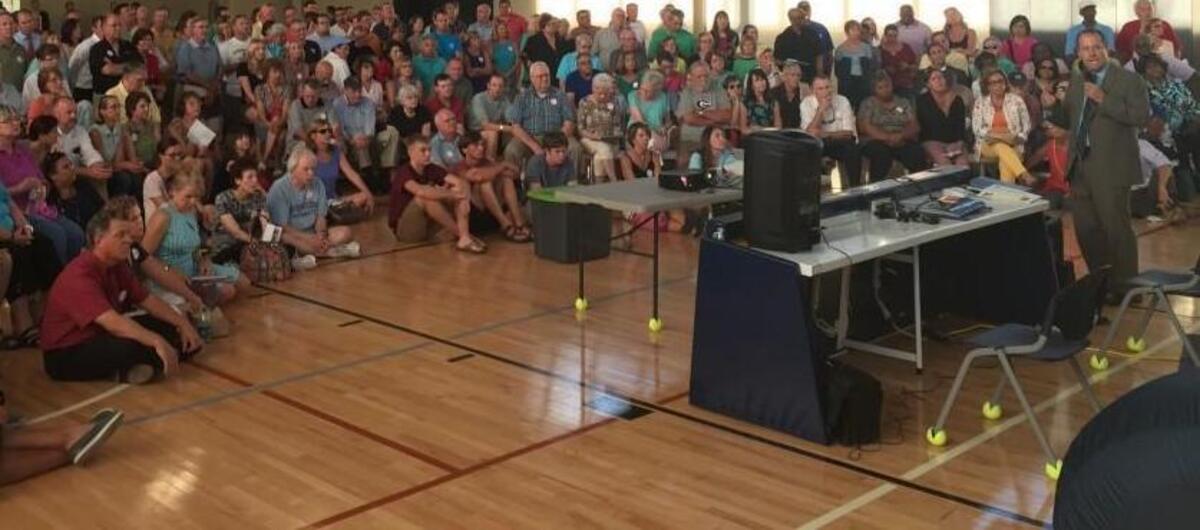 Residents listen to a presentation on a proposed development at the corner of Falls of Neuse and Raven Ridge roads at the North Citizens Advisory Council on Tuesday, Aug. 16, 2016.