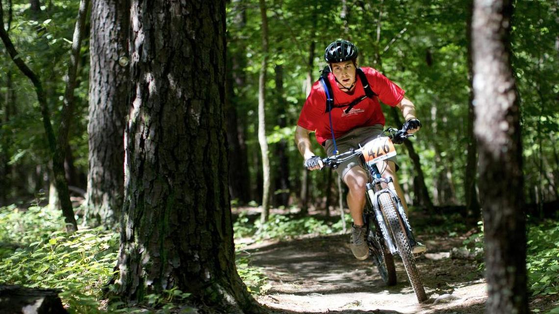 Erik Mitran nears the end of the trail during an annual festival hosted by Triangle Off-Road Cyclists at Lake Crabtree Park June 21, 2015 in Raleigh, N.C.