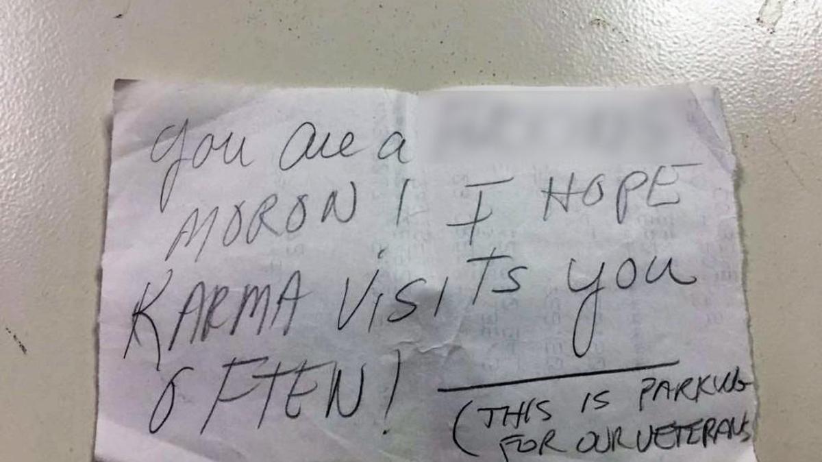 The note, with expletive electronically blurred.
