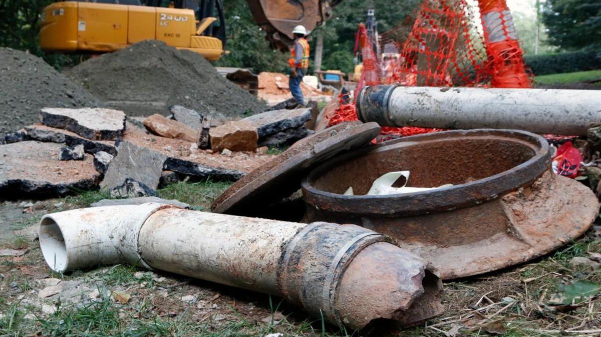 A discarded section of temporary sewer line lies broken up along Raleigh’s Hertford Street on August 14, 2015, as workers replace older, leak prone terra-cotta sewer lines with larger ductile iron sewer pipes before sewage leaks become chronic.
