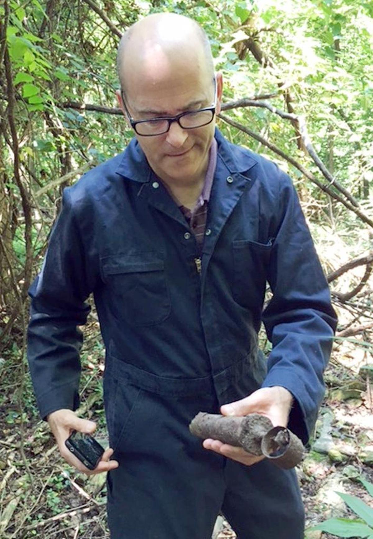 Mark Turner with a pipe or tool found at the site of Isaac Hunter’s tavern.