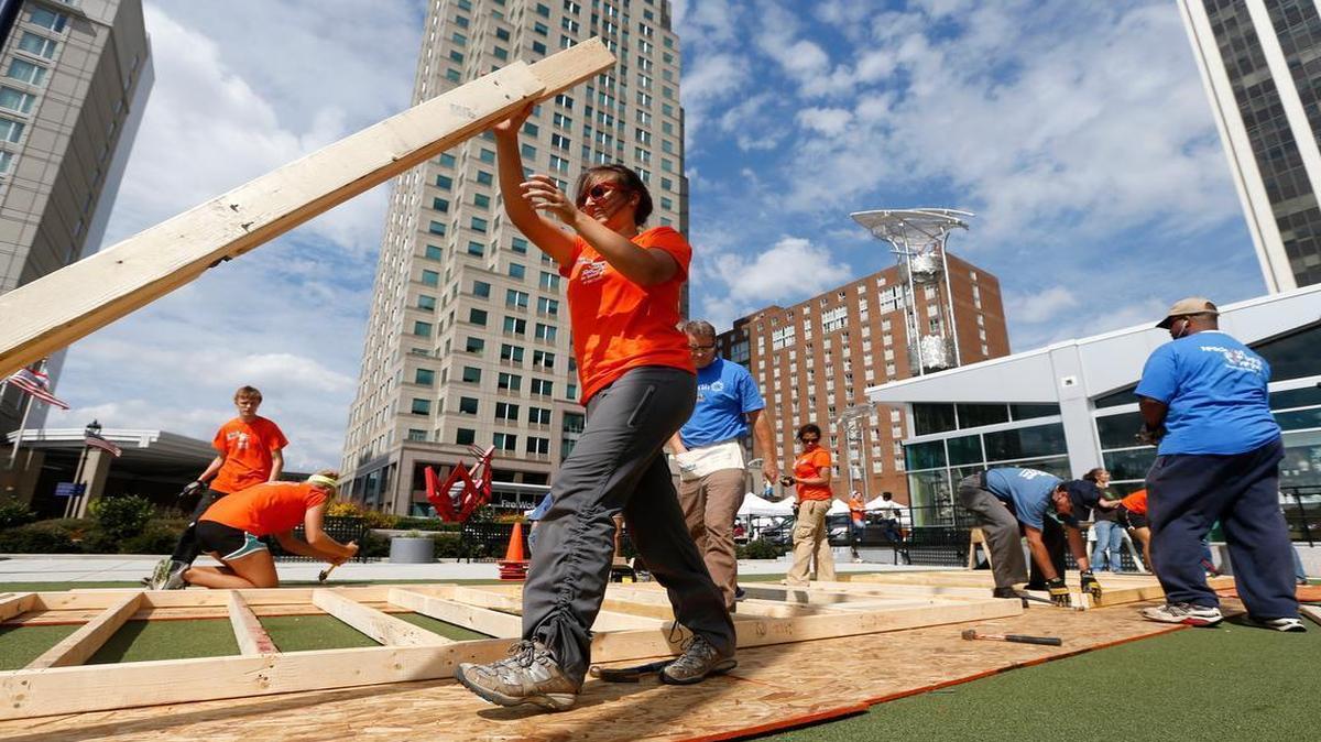
AmeriCorps volunteers build walls for Habitat for Humanity during a 2013 event at the Downtown Raleigh Farmers Market. One part of the Raleigh City Council’s proposal to encourage developers to develop affordable housing would allow the city to make loans to groups such as Habitat for Humanity, encouraging them to rebuild vacant or dilapidated properties near transit stations.
