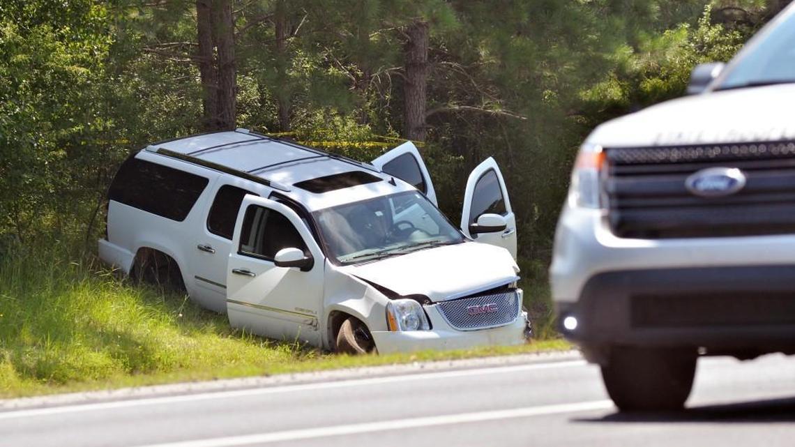 A wrecked SUV is shown at the scene where officials were involved in a shooting on westbound Interstate 40 near Benson, N.C. Saturday, July 8, 2017.