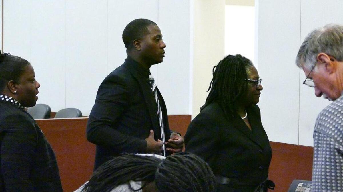 
Jonathan Ferrell's brother, Willie Ferrell (center left) and mother Georgia Ferrell (center right) exit the courtroom Friday morning. Randall Kerrick testified again on Friday in the trial in which he is charged with voluntary manslaughter of Jonathan Ferrell. The trial continued on Friday, August 14, 2015.
