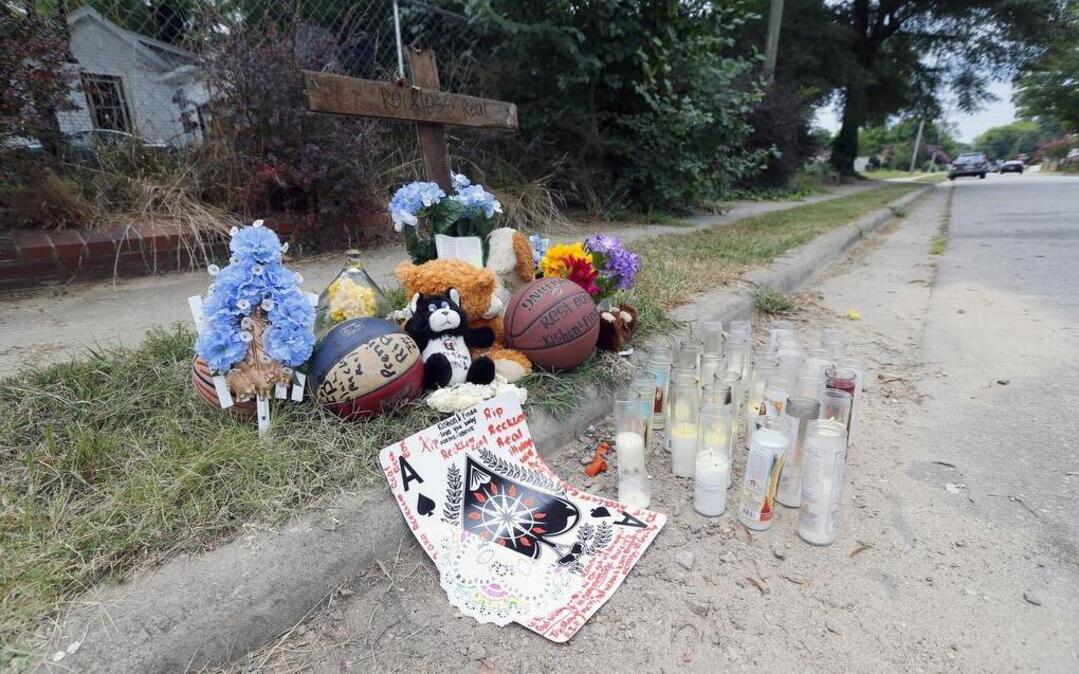 
A makeshift memorial is seen near the intersection of State St. and Jones St. in Raleigh on August 10, 2015 for 13-year-old Keyshawn Tyrell Gregory who was killed on Friday night. Malik Armein Jones, 19, was charged with one count of murder and two counts of attempted murder. Jones is accused of shooting Gregory outside a home on Beauty Avenue east of downtown.
