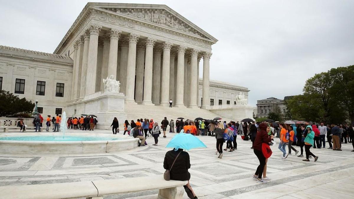 People wait in line to enter the US Supreme Court, on April 19, 2017 in Washington, DC.