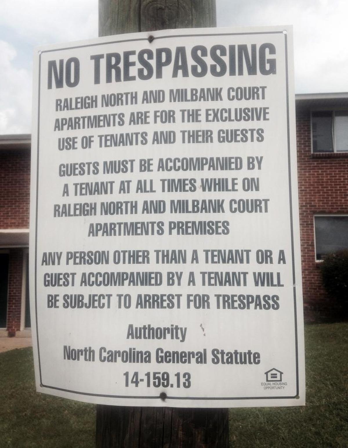 A sign at Milbank Court apartments warns unauthorized visitors that they can be charged with trespassing.