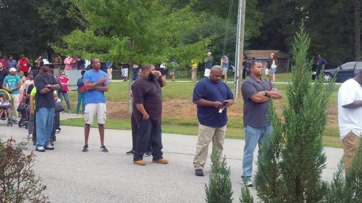 People wait outside State Street Community Church in Raleigh on Sept. 19 to complete forms seeking to have convictions expunged from their criminal records in Wake County.