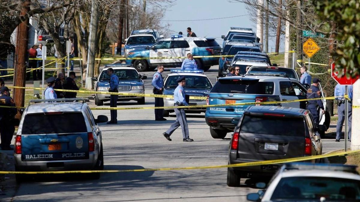 Police work the scene near the location where Raleigh officer D.C. Twiddy fatally shot Akiel Denkins while attempting to arrest him in the vicinity of Bragg and East streets on Feb. 29.