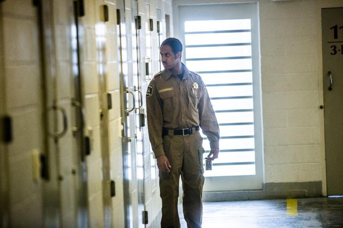 A corrections officer performs a cell check at the Durham County Detention Facility.