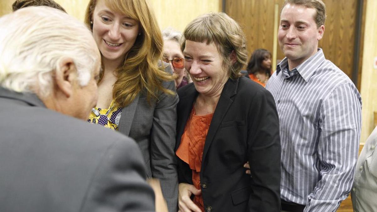 Margaret and Martha Ratliff and Michael Peterson’s son Clayton Peterson celebrate with investigator Ron Guerette after Judge Orlando Hudson ruled on December 14, 2011, that Michael Peterson would get a new trial.