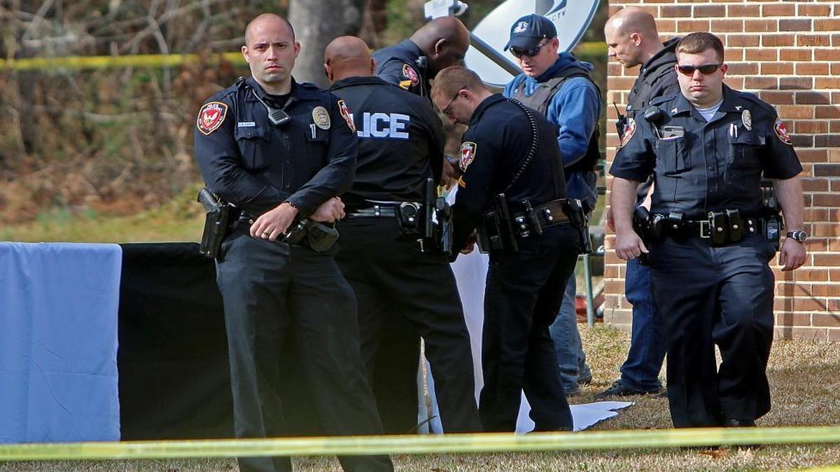 Law enforcement are pictured in the 2500 block of Glenbrook Drive north of West Club Boulevard Wednesday afternoon, securing the scene where a man was shot and killed by police.