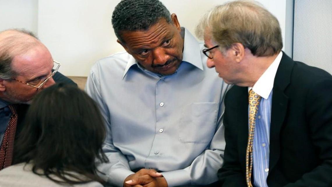Darryl Anthony Howard, center, listens to his attorneys Jim Cooney, left, Barry Scheck, co-director of the N.Y. based Innocence Project, right, and Seema Saifee, a staff attorney with the Innocence Project, during a break at a hearing seeking relief from two murder verdicts against Howard at the Durham County Justice Center in Durham, N.C., Tuesday, August 30, 2016.