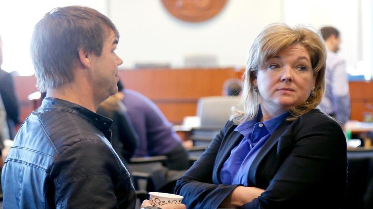 Lawyer Christine Mumma, right, with the N.C. Center for Actual Innocence talks with Dwayne Dail during a break at the N.C. State Bar in Raleigh, NC where she is having a disciplinary hearing on Monday, Jan. 11, 2015. Dail was exonerated of rape charges largely due to the work of Mumma's commission.