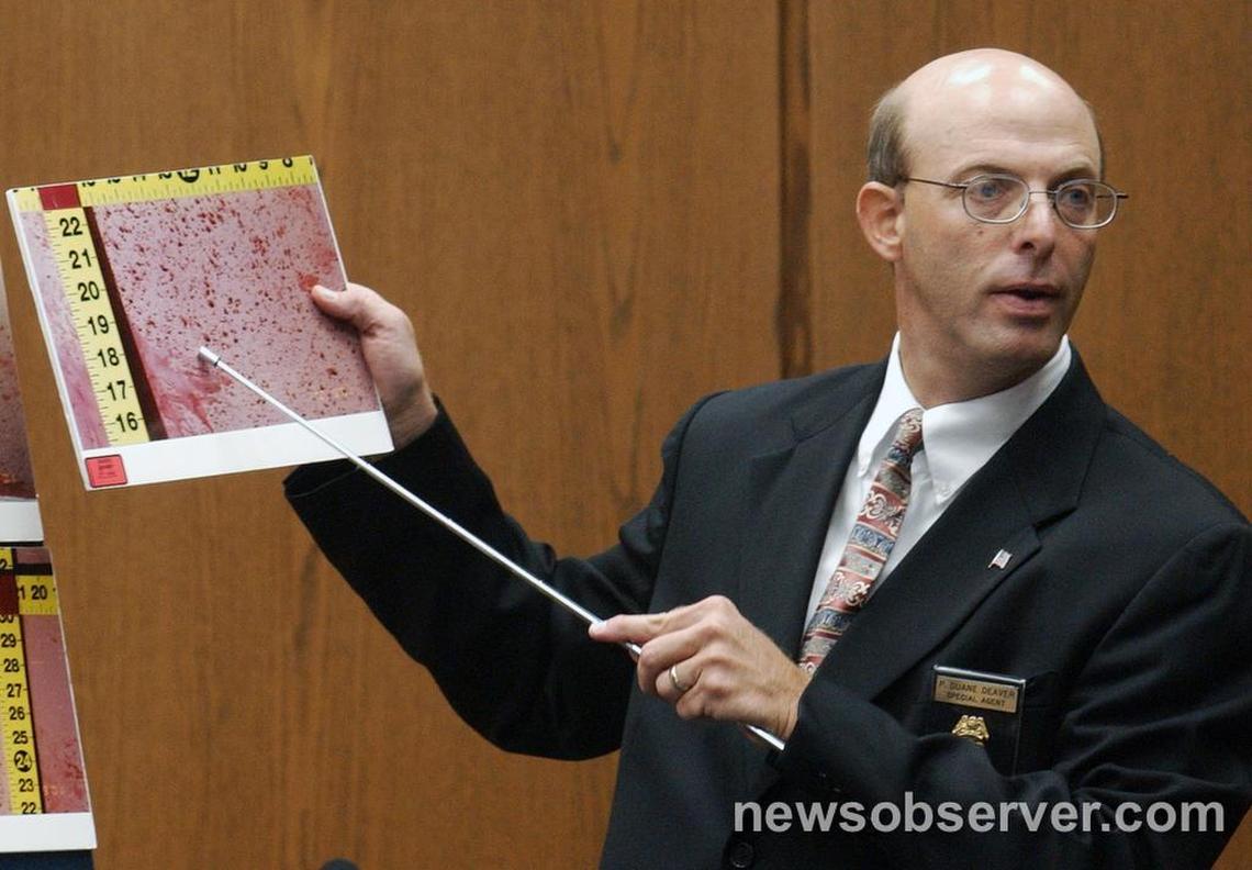 SBI expert Duane Deaver makes a point about blood splatter at the murder trial of Michael Peterson in Durham in August 2003.