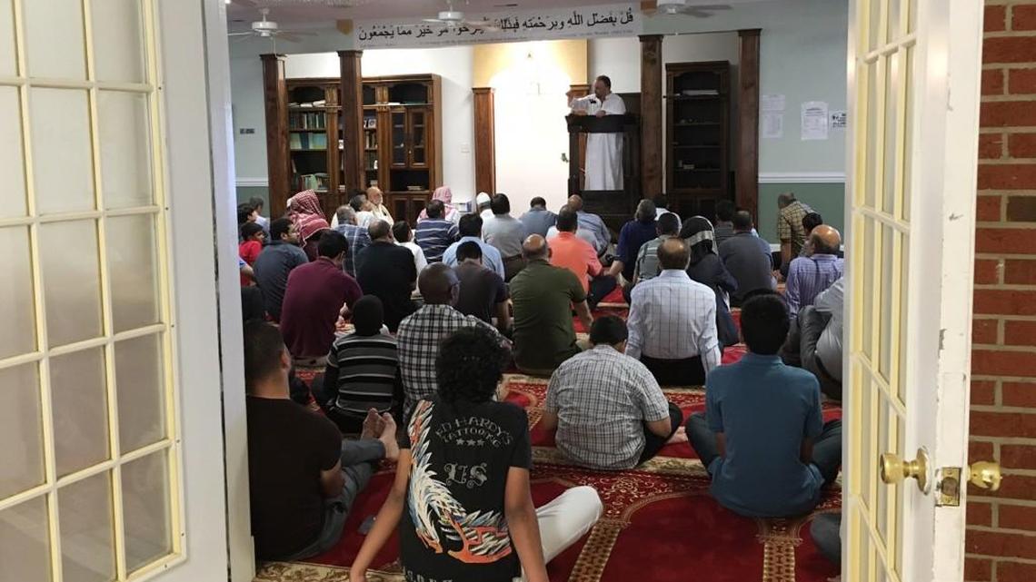 Members of the Masjid Al Madina mosque in Raeford, N.C., attend a service, Friday, June 10, 2016, the day after a man was arrested for threatening them. Authorities say that an Army reserve officer brandished a handgun while threatening to kill people at the mosque. (AP Photo/Anna Gronewold)
