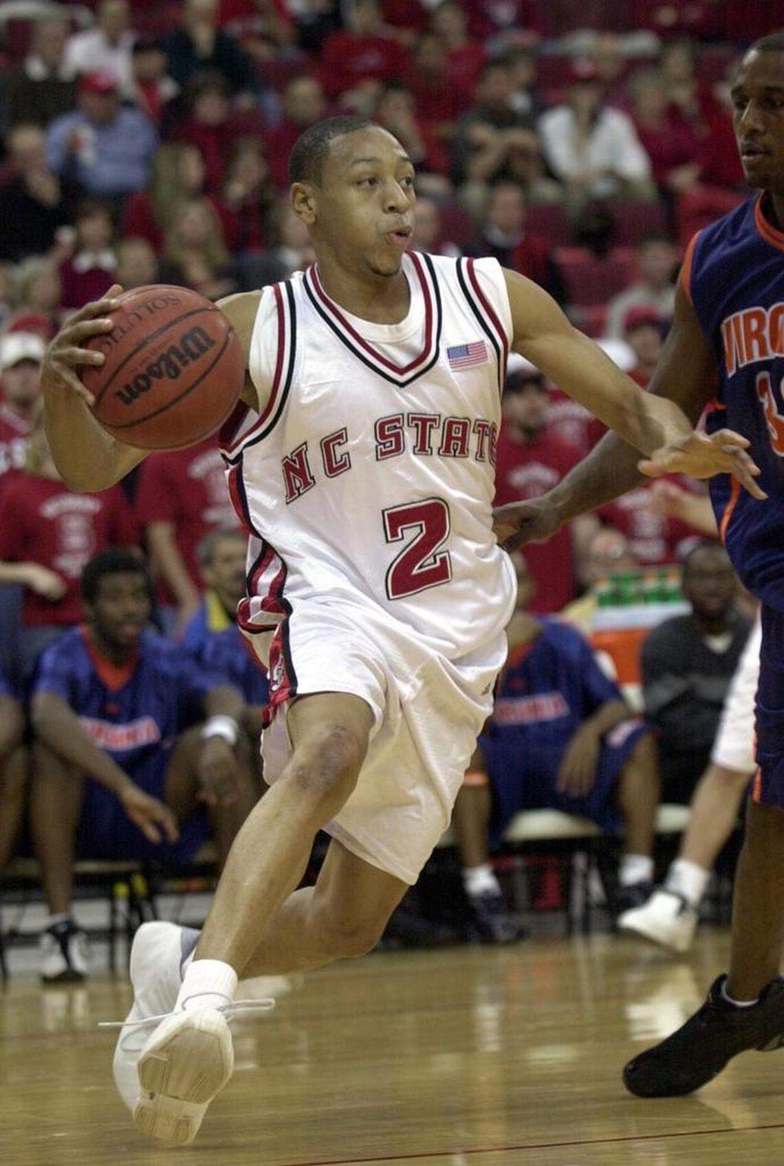 NC State’s Anthony Grundy drives the baseline against UVA’s Chris Williams in a 2002 game.