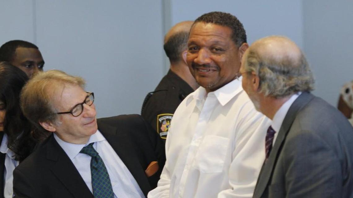 Innocence Project defense attorneys Barry Scheck, left, and Jim Cooney, right, were happy for their client Darryl Anthony Howard, center, at the end of the bond hearing for Howard in Durham Superior Court on July 11, 2014.