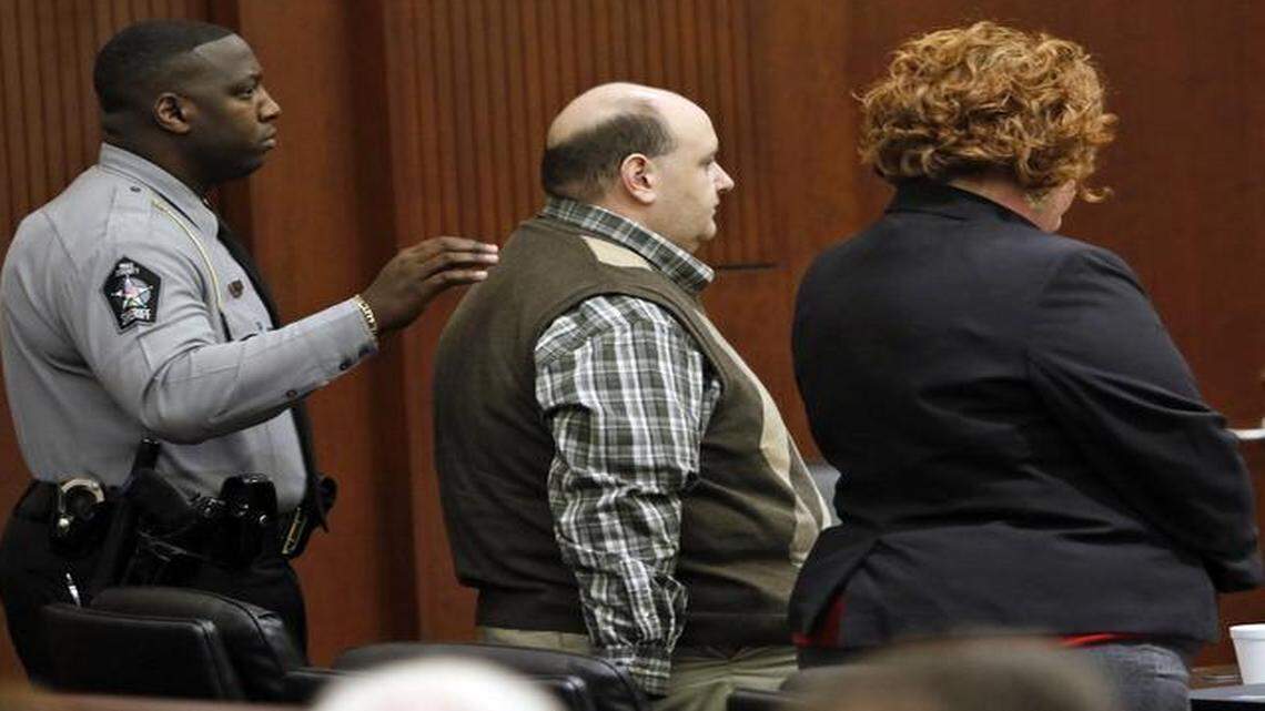 
From left, Wake Sheriff’s Deputy T.V. Edwards prepares to escort Jonathan Broyhill out of court Thursday after Broyhill was sentened to life in prison in the murder of Jamie K. Hahn in April 2013. Defense attorney Caroline Elliot stands at right. 

