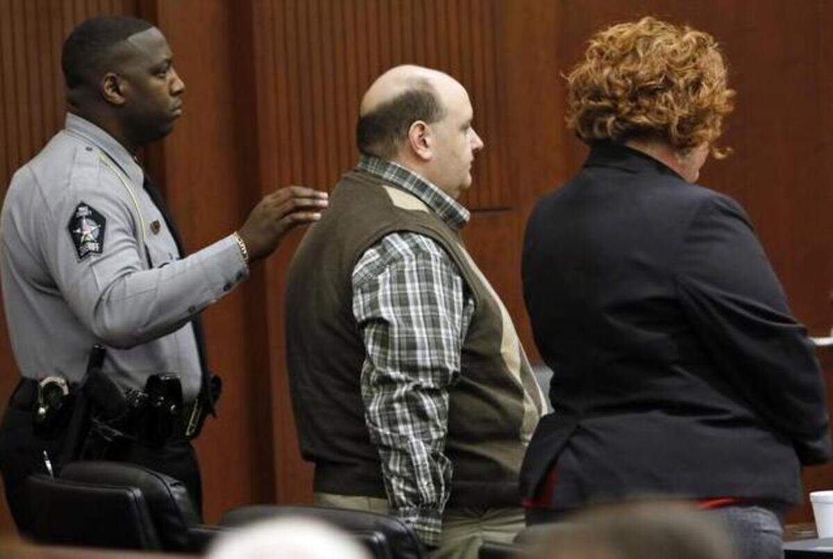 
From left, Wake Sheriff’s Deputy T.V. Edwards prepares to escort Jonathan Broyhill out of court Thursday after Broyhill was sentened to life in prison in the murder of Jamie K. Hahn in April 2013. Defense attorney Caroline Elliot stands at right. 
