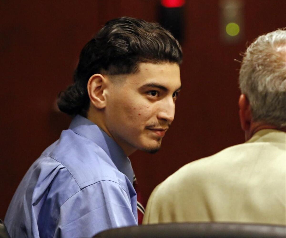 Murder defendant Jonathan Santillan, photographed Aug. 28, 2015, listens to his defense attorney Jeff Cutler during jury deliberations in Wake Superior Court. Santillan was convicted in the shooting deaths of Jose and Maria Mendoza in their Wake County home in January 2013.