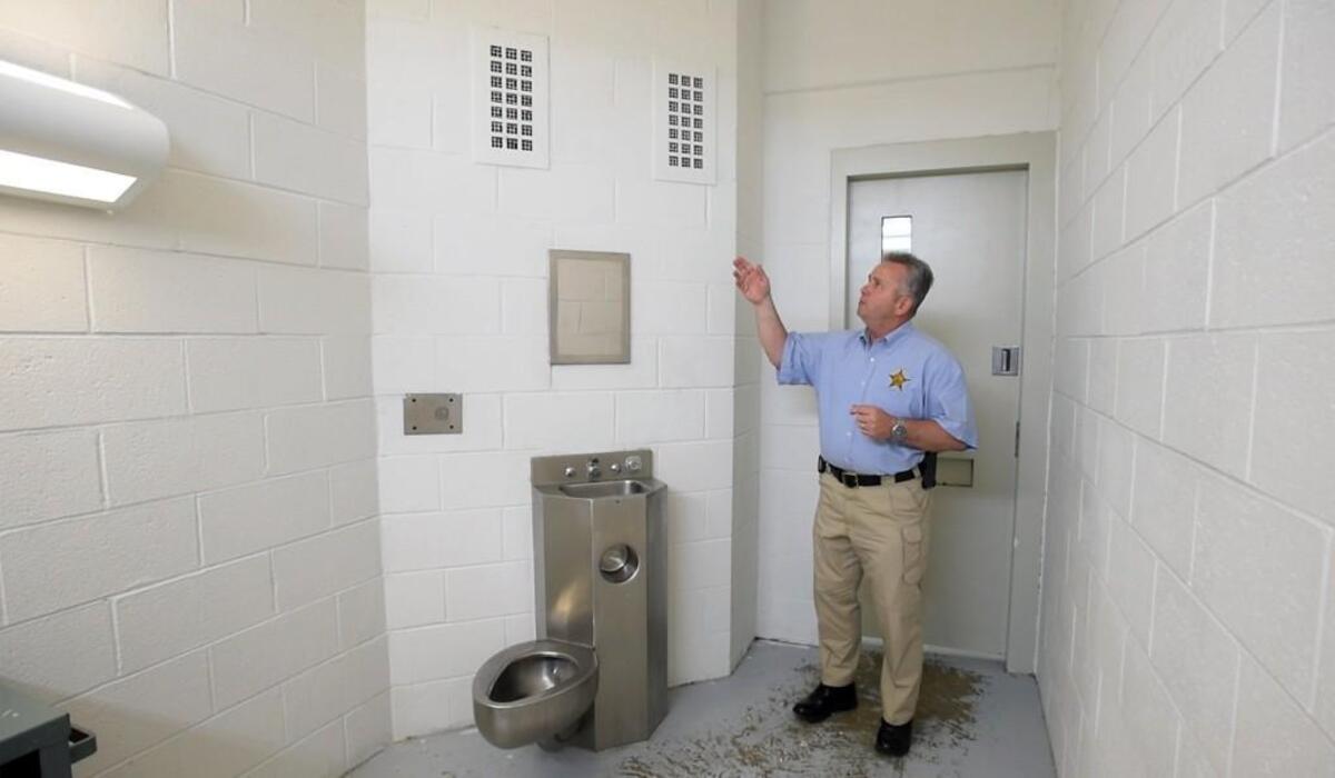 Durham County Sheriff Mike Andrews on June 6, 2016, discusses the old grates in jail cells which were replaced with new “suicide proof” grates in a wing of the Durham County Detention Center.