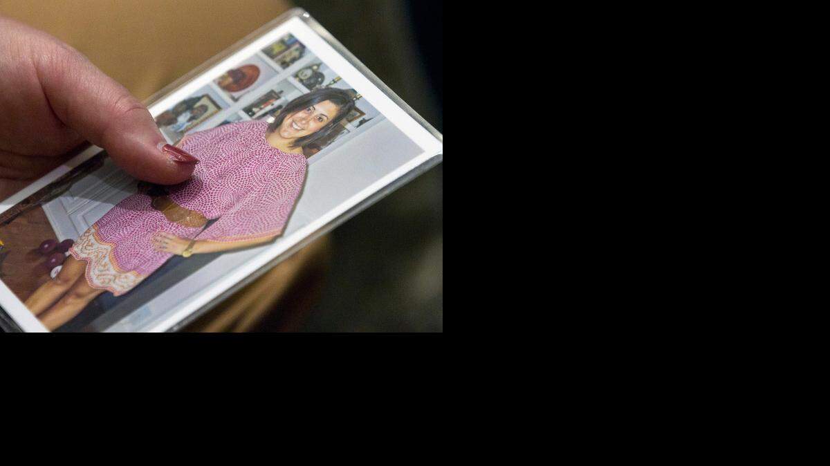 
A family member holds a photo of Jamie Hahn as  Jonathan Broyhill‘s murder trial continues March 5 in  Wake County. Broyhill is accused of killing Jamie Kirk Hahn, a rising star among Democratic strategists and fundraisers, and attempting to kill her husband and his childhood friend, Nation Hahn.
