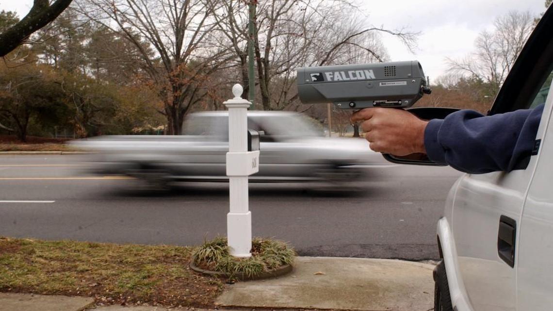 A Raleigh police officer uses a radar gun to check vehicle speeds in this file photo. Wake County District Attorney Lorrin Freeman is reviewing dozens of pending traffic citations after Raleigh police notified her of problems with the radar guns used to detect speed in those cases.