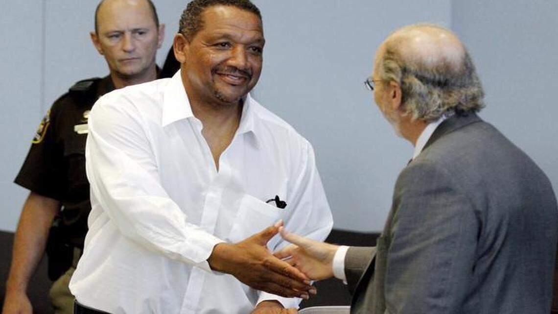 
Darryl Howard, left, shakes hands with Innocence Project attorney James Cooney III in Durham Superior Court  in 2014.
